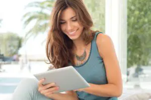 Smiling Woman With Digital Tablet